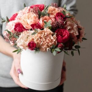 Hat-boxes floral arrangement by Lavender and Lilacs Florist